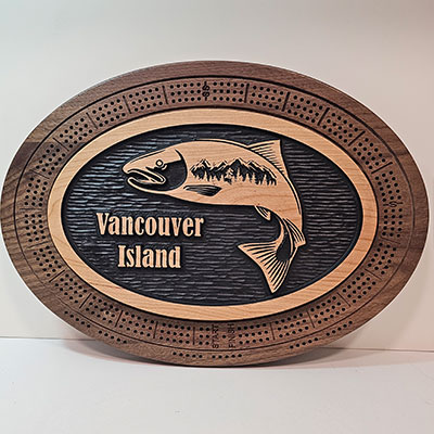 Custom wooden cribbage board with engraved salmon and Vancouver Island text on black inlay